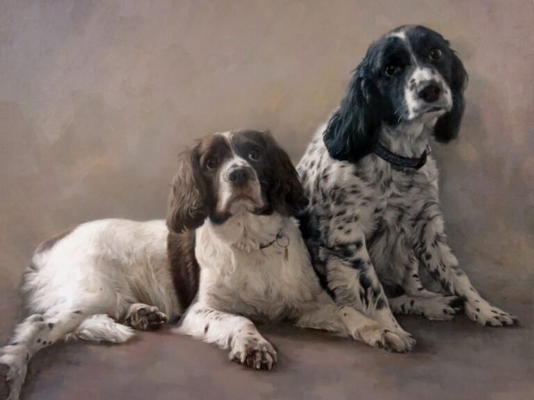 Portrait of two dogs lying side by side, hand-painted in oil from a photograph
