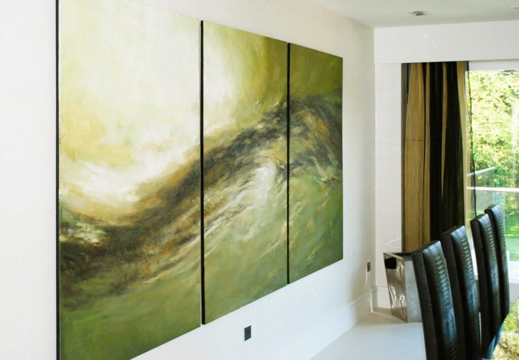 A green abstract triptych painted across three panels