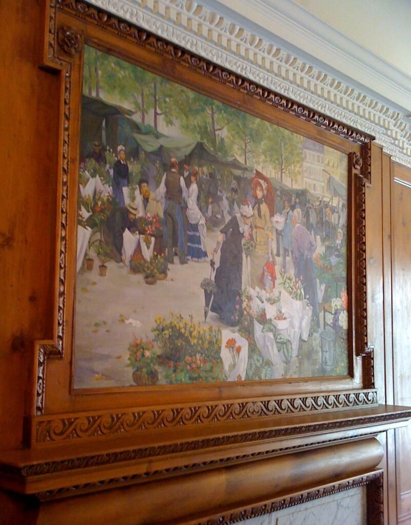 A reproduction set into a carved timber overmantel above a fireplace